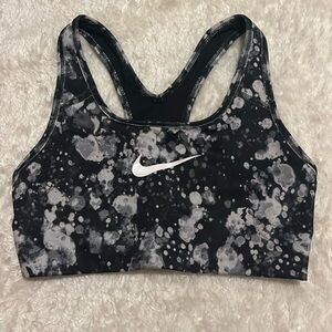Black and white Nike sports bra with no pads. Size: Adult Small